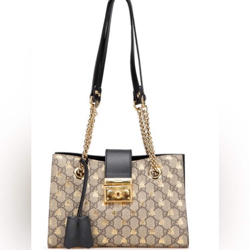 Gucci Small Padlock GG Supreme Shoulder Bag with a gold bee print